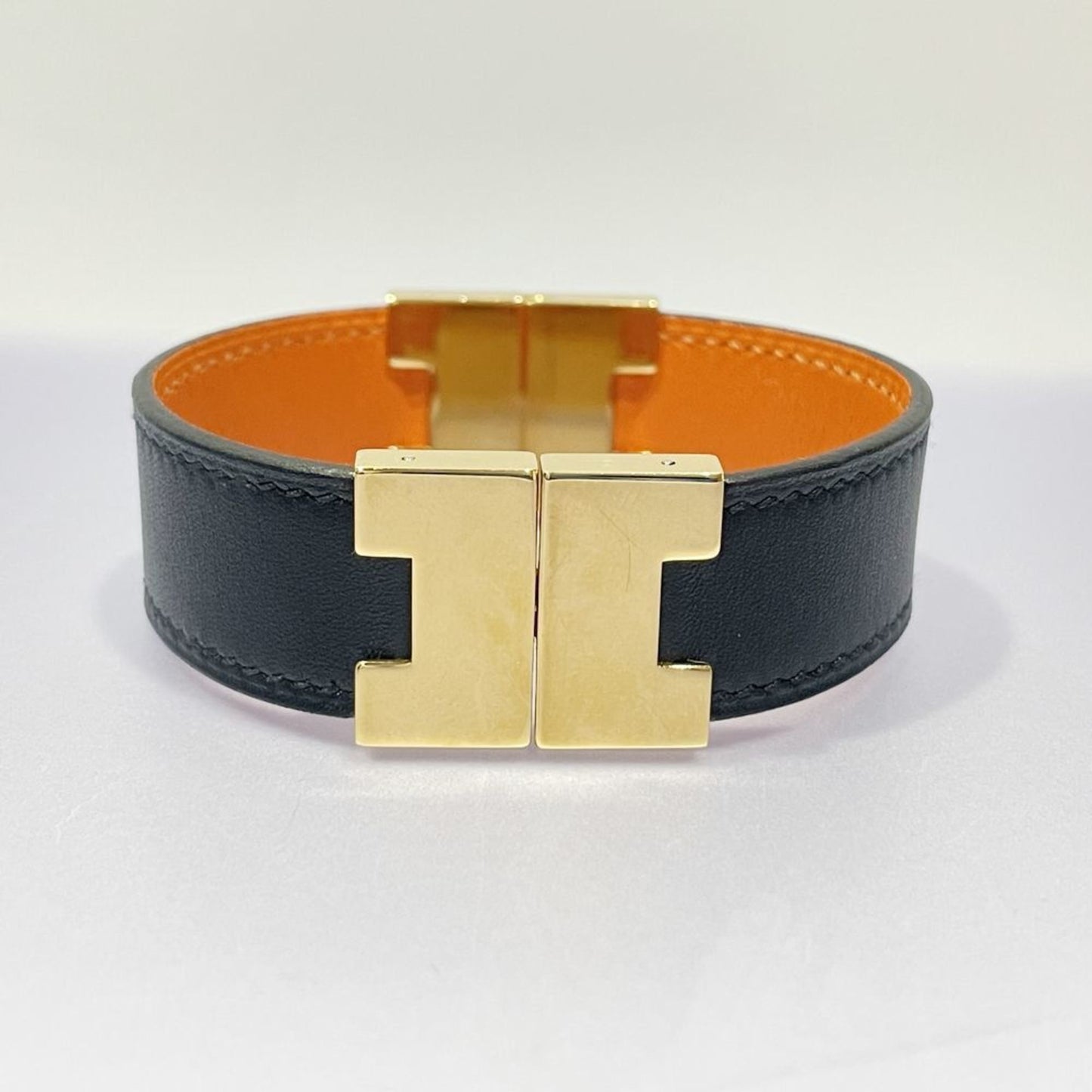 Hermès Leather Reversible H Bracelet Orange and Black